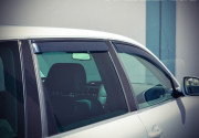 Volkswagen Touareg 2003-2010 - Дефлектори вікон з метал чорним молдингом, к-т 4 шт (Wellvisors) фото, цена